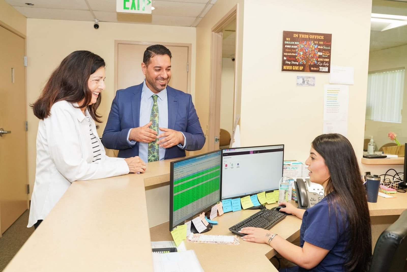 Dr. Saadi providing hemorrhoid treatment consultation in San Diego clinic with patient